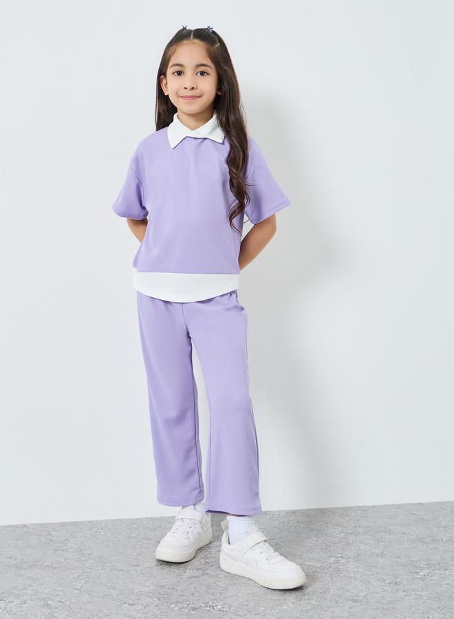 ستايلي مجموعة من بنطال وبلوزة بتفاصيل محبوكة - Image 1